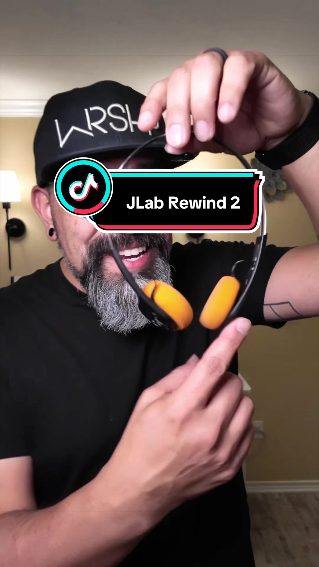 TikTok post by @rickandcait_tt_shop for JLab. Caption reads: These retro headphones by @JLab take me waaaaay....