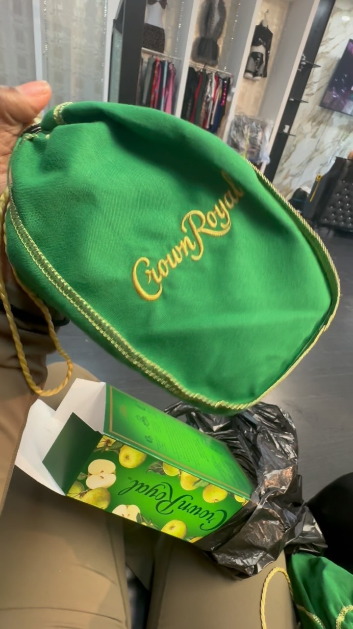 Instagram post by @sukihanagoat for Crown Royal. Caption reads: This what my purse been. I want all my coochie....