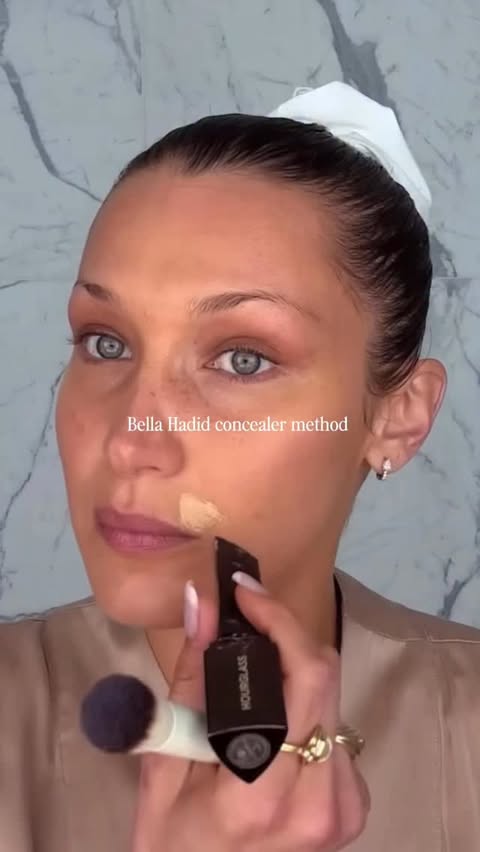 Instagram post by @haleyyrackliffe for Hourglass Cosmetics. Caption reads: Trying Bella Hadid’s exact concealer method. I’m....