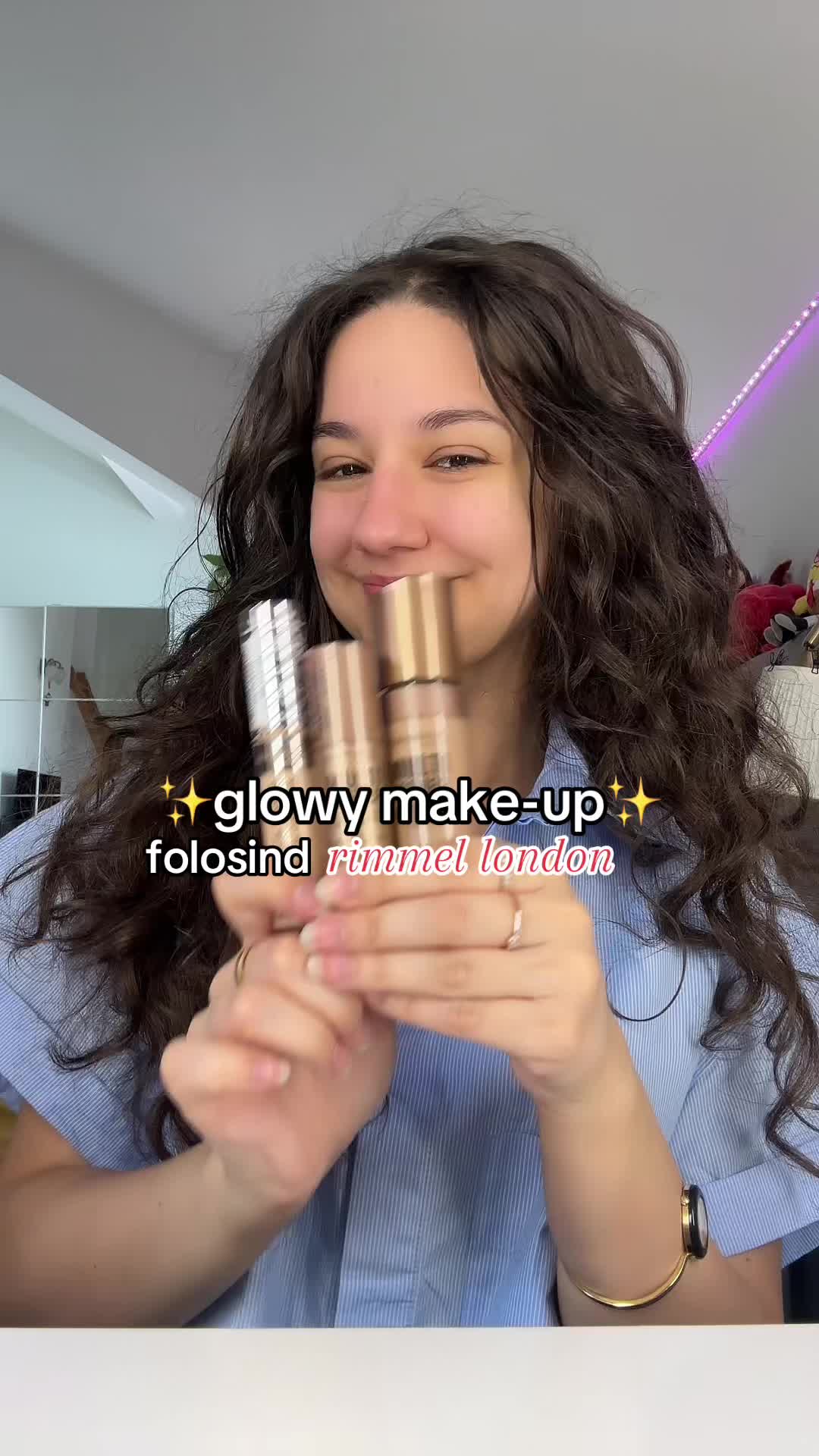 TikTok post by @heyitsalexandraaa for rimmellondon. Caption reads: Glowy make-up cu produsele vedete Rimmel....