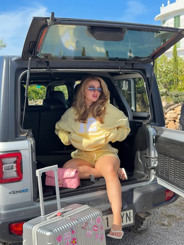 Instagram post by @millie.margot for KAIIA. Caption reads: touch down in ibiza wearing @kaiiathelabel....