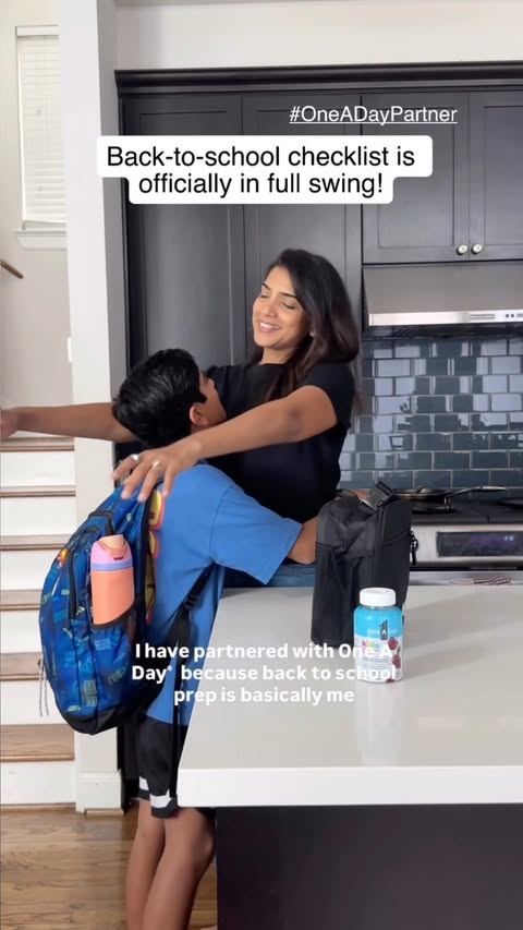 Instagram post by @thesnazzymom for New Engen Creators. Caption reads: #OneADayPartner Back-to-school prep as a mom is....