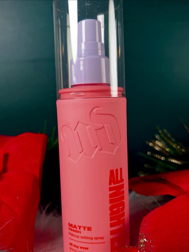 Instagram post by an influencer for Urban Decay Cosmetics. Caption reads: [...] a setting spray and @urbandecaycosmetics has....