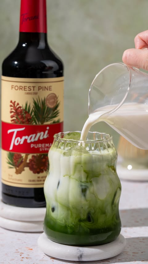 Instagram post by @stir.taste.smile for Torani. Caption reads: Iced matcha with Torani’s new Puremade Forest Pine....
