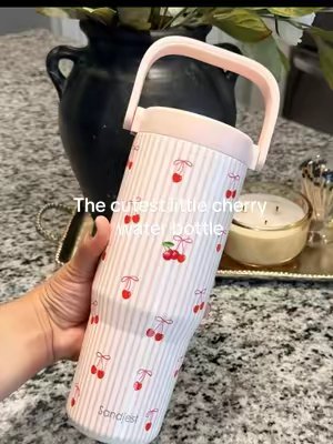 TikTok post by @jenny.cad for Sandjest. Caption reads: [...] cutest little cherry water bottle 🍒🎀....
