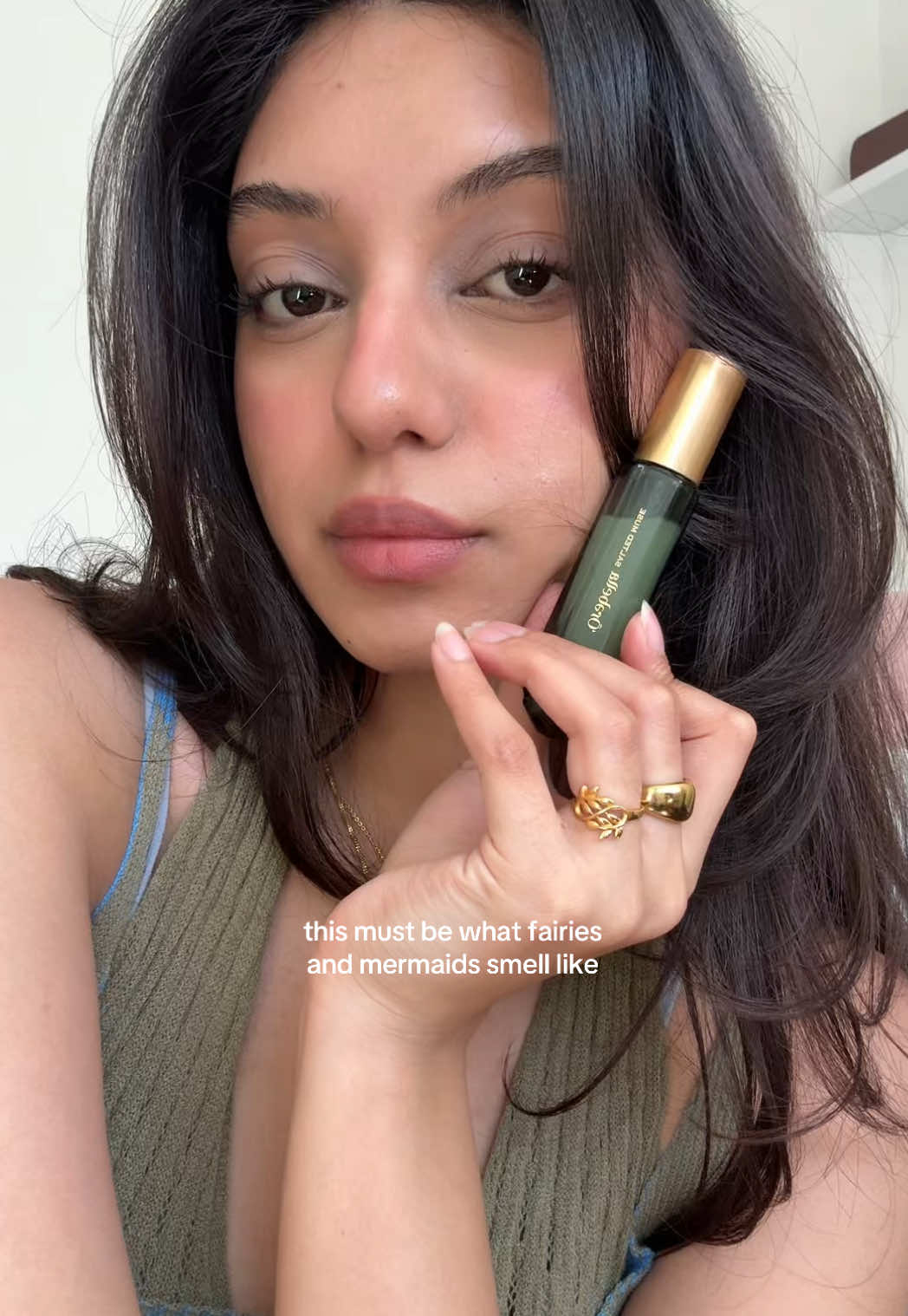 TikTok post by @028ze for Orebella. Caption reads: [...] sandlewood, amber @Bella Hadid gifted*....