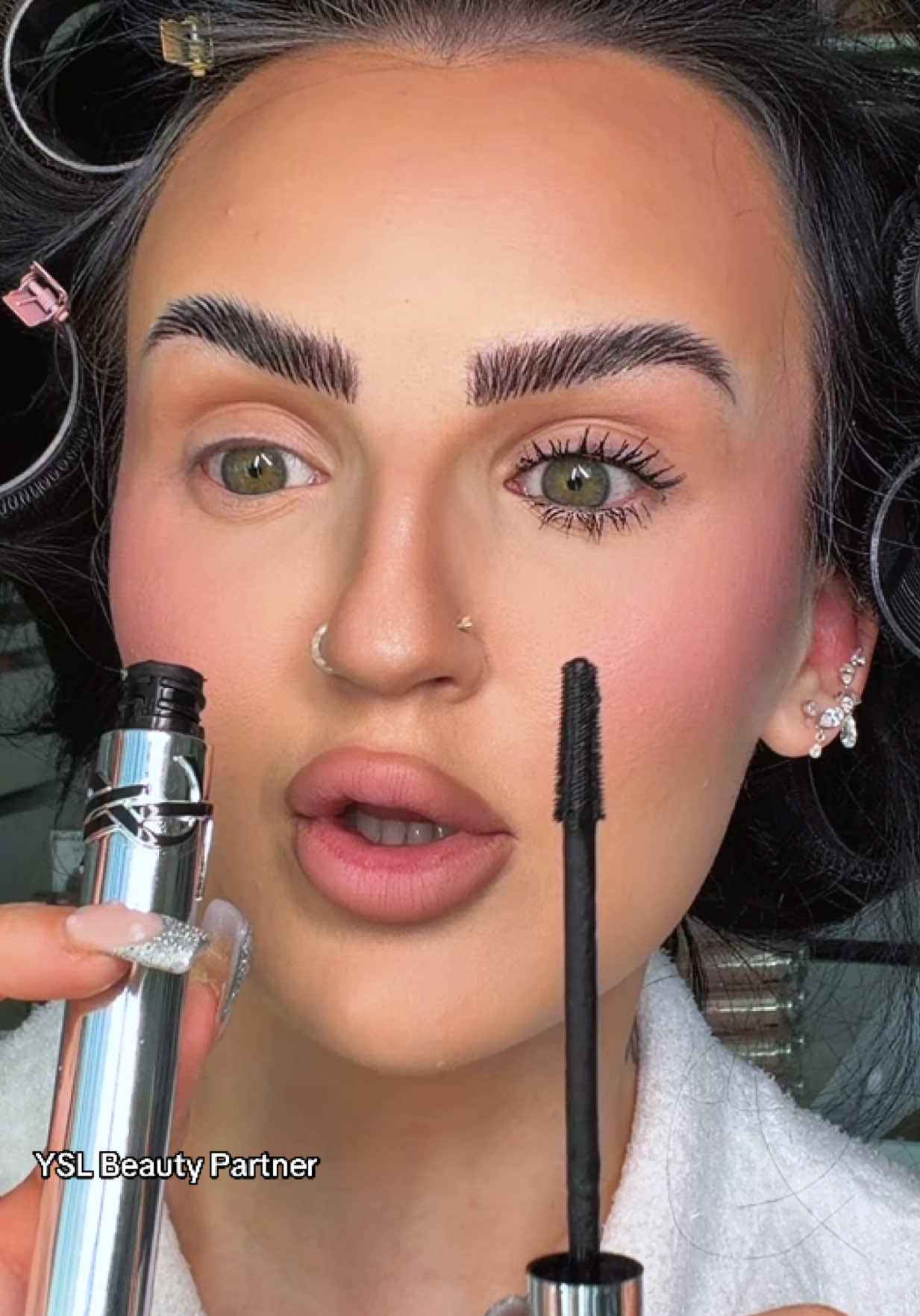 TikTok post by @mikaylanogueira for YSL Beauty. Caption reads: [...] makeup of 2025 video.. lash latex mascara by....