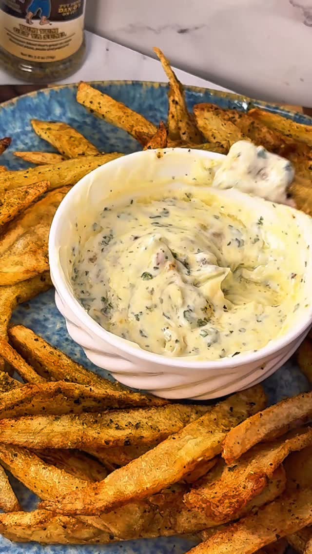 Instagram post by @itskristinskitchen for Dan-O's Seasoning. Caption reads: Cheesy Truffle Fries with Roasted Garlic Aioli....