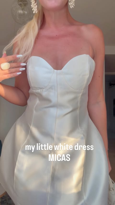 Instagram post by an influencer for MICAS. Caption reads: [...] little white dress 🤍✨by @micas.official 🛍️....