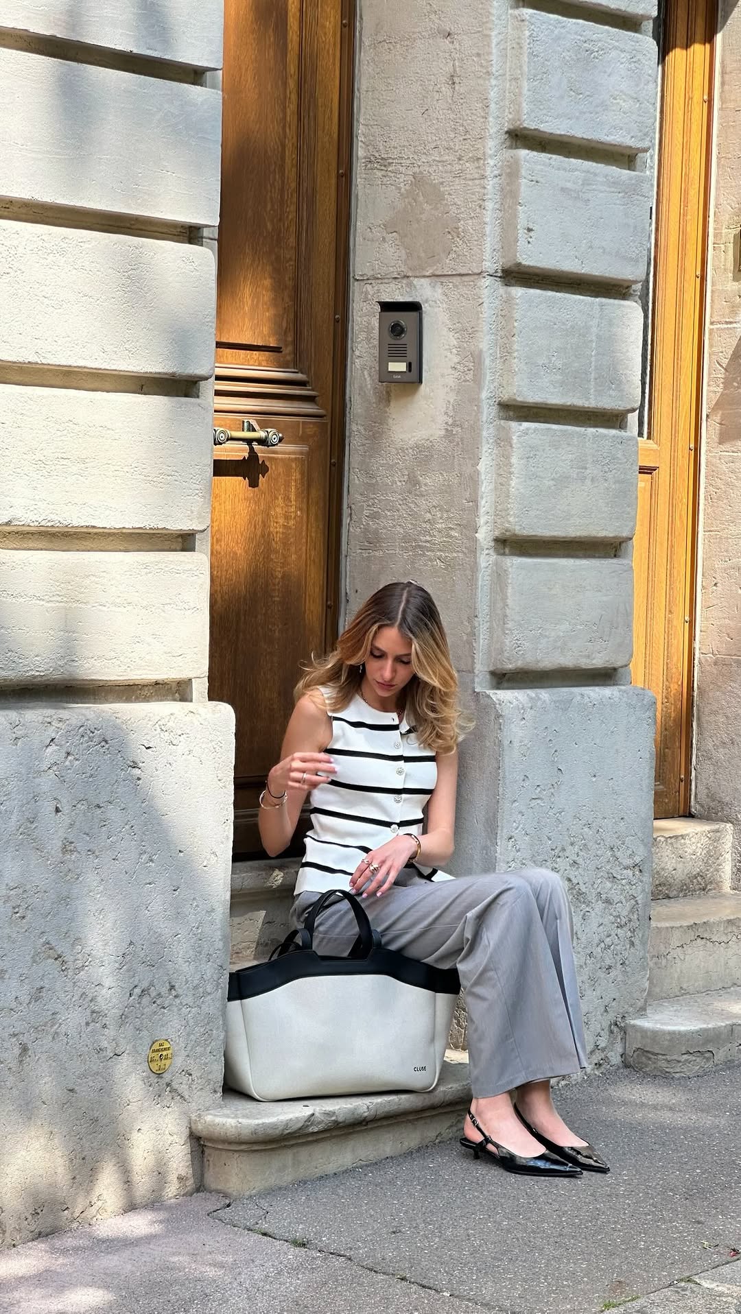 Instagram post by @lanajacobsson for CLUSE. Caption reads: A little ootd with this lovely bag @cluse 🖤....