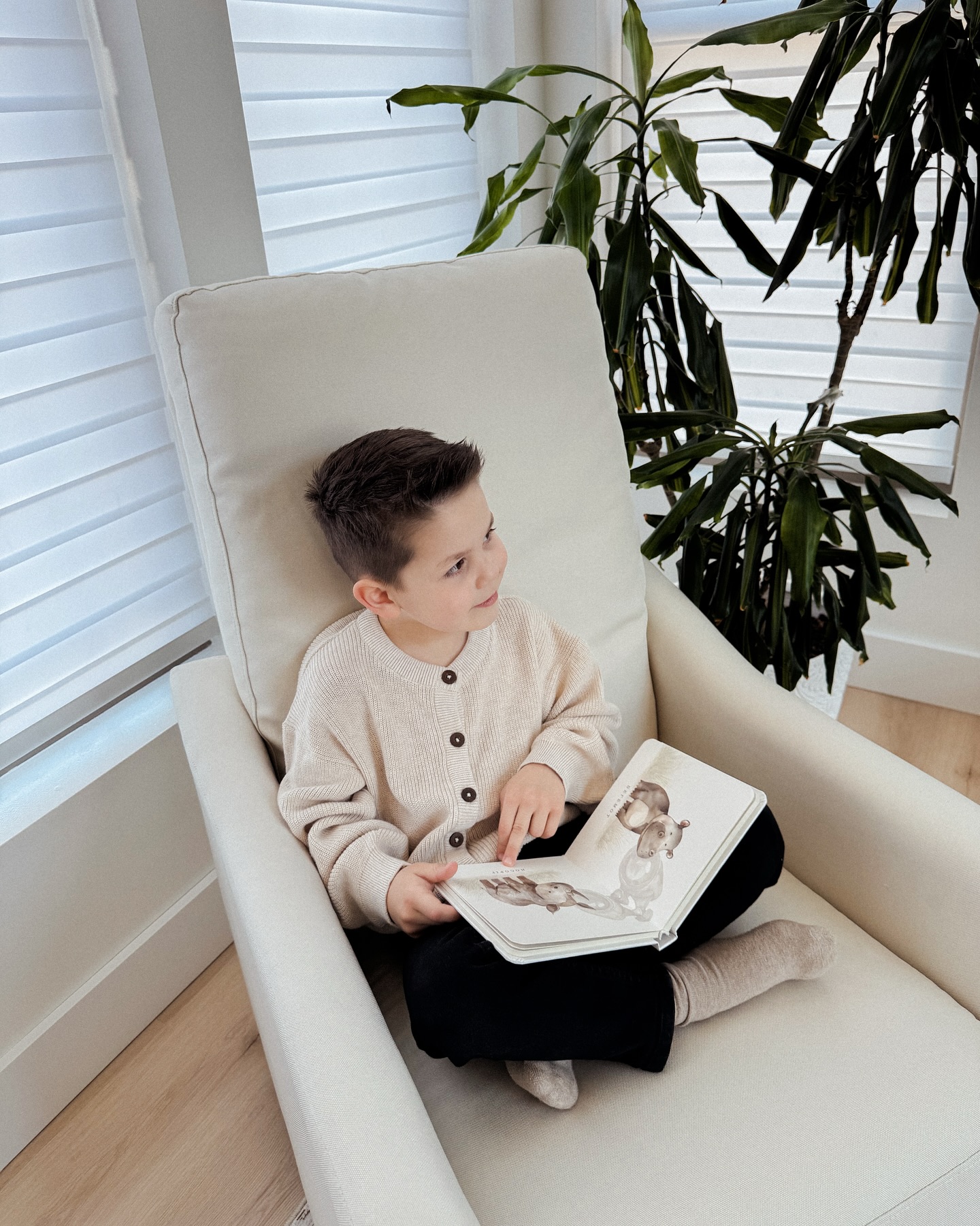 Instagram post by @natalie_ignatov for Delta Children. Caption reads: Cozying up this corner with a favorite book....