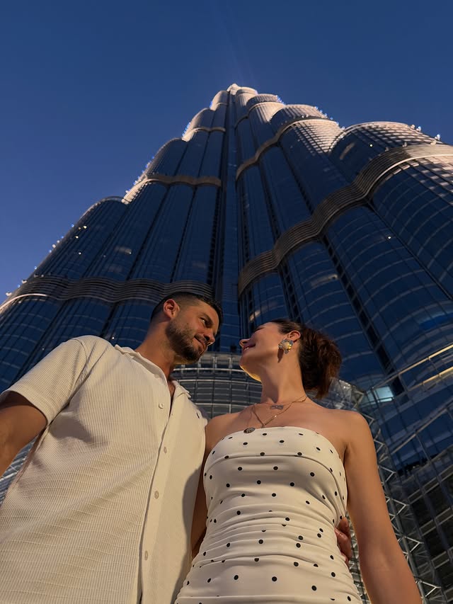Instagram post by @yildiz_c_atiksoy for Visit Dubai. Caption reads: [...] skies to downtown nights... Dubai ✨....