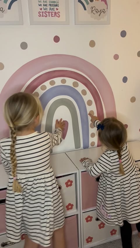 Instagram post by @emilylouisahousex for Nursery Stickers. Caption reads: I am obsessed 🌈🩷
(And so are my little rainbow....