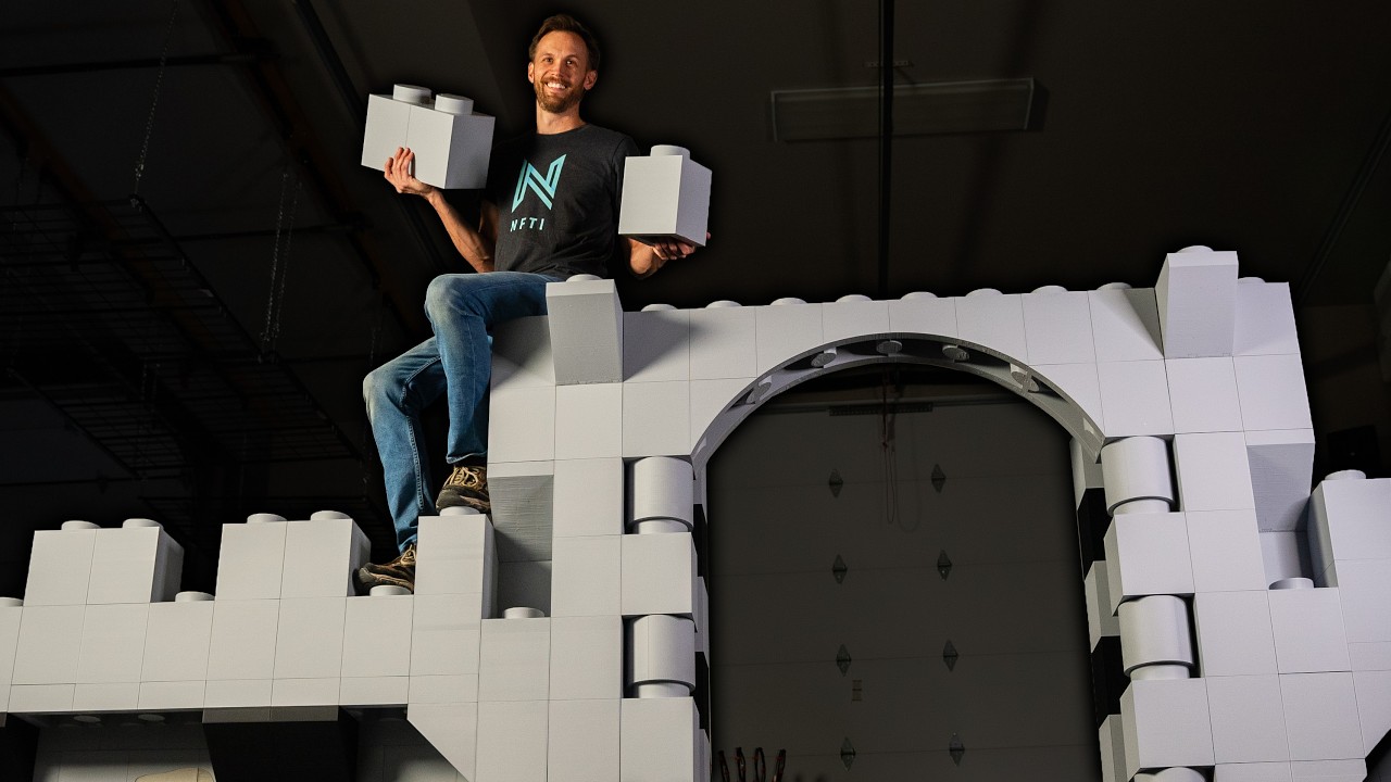YouTube post by @NFTI for ExpressVPN. Caption reads: A 3D Printed Lego-Style Castle, Bigger than Ever!.