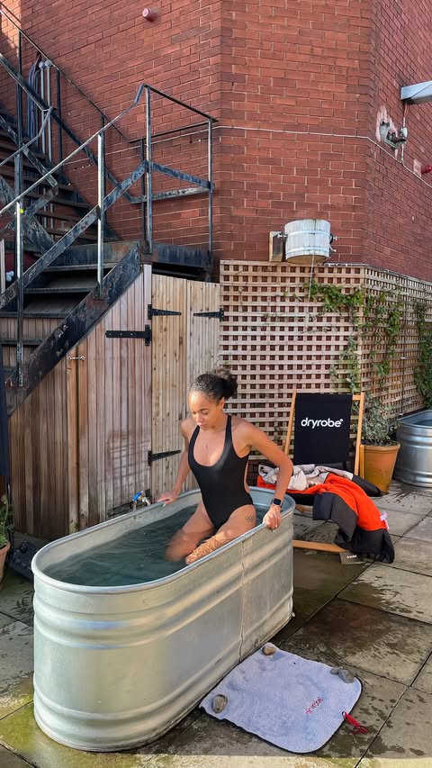 Instagram post by @alicedearingx for dryrobe. Caption reads: Cold baths and saunas with @dryrobe 🧡 It was a....