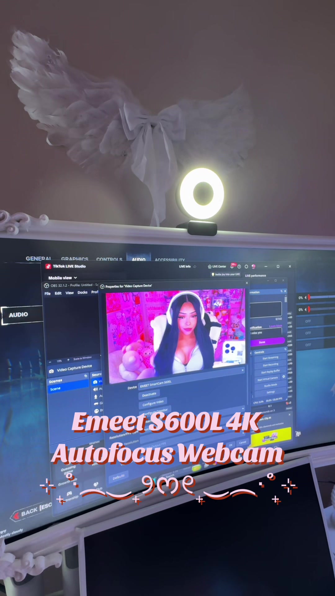 TikTok post by @stopitvictoria for EMEET. Caption reads: IM ACTUALLY OBSESSED WITH THIS CAMERA.....