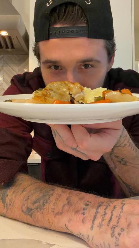 Instagram post by @brooklynpeltzbeckham for Express. Caption reads: [...] chicken, mashed potatoes, and a side of....