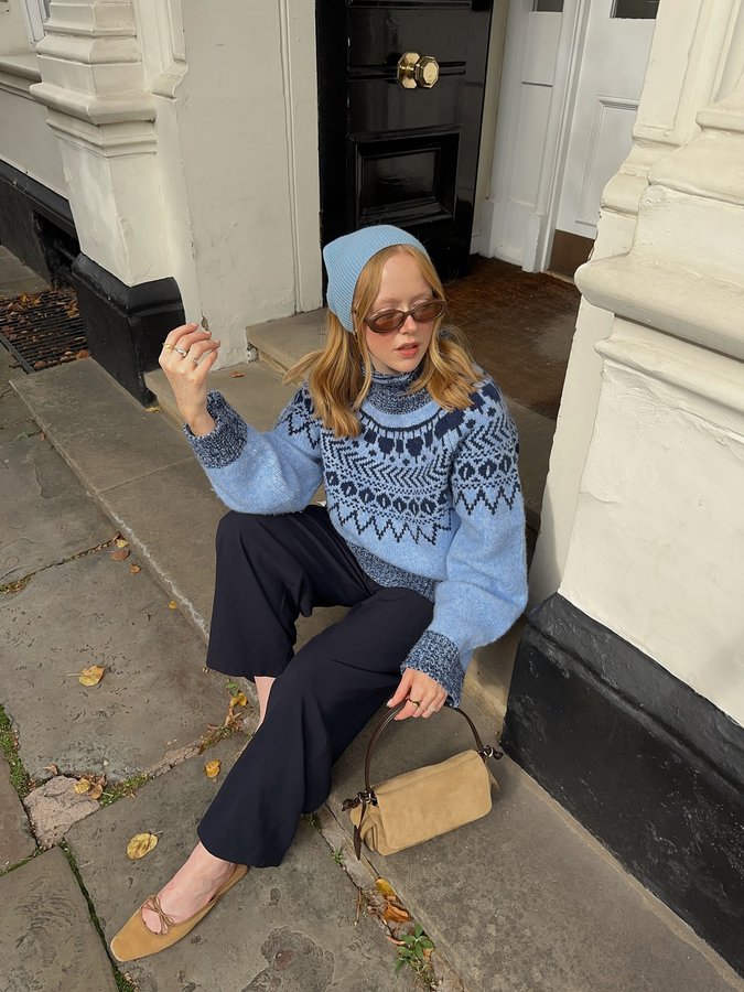 Instagram post by @hollyrebeccawhite for Baum und Pferdgarten. Caption reads: [...] favourite knit this season 🩵....