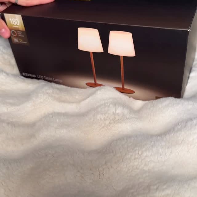 Instagram post by @melissasjohn for EZVALO. Caption reads: This lamp is a total game changer! 💡✨ Whether....