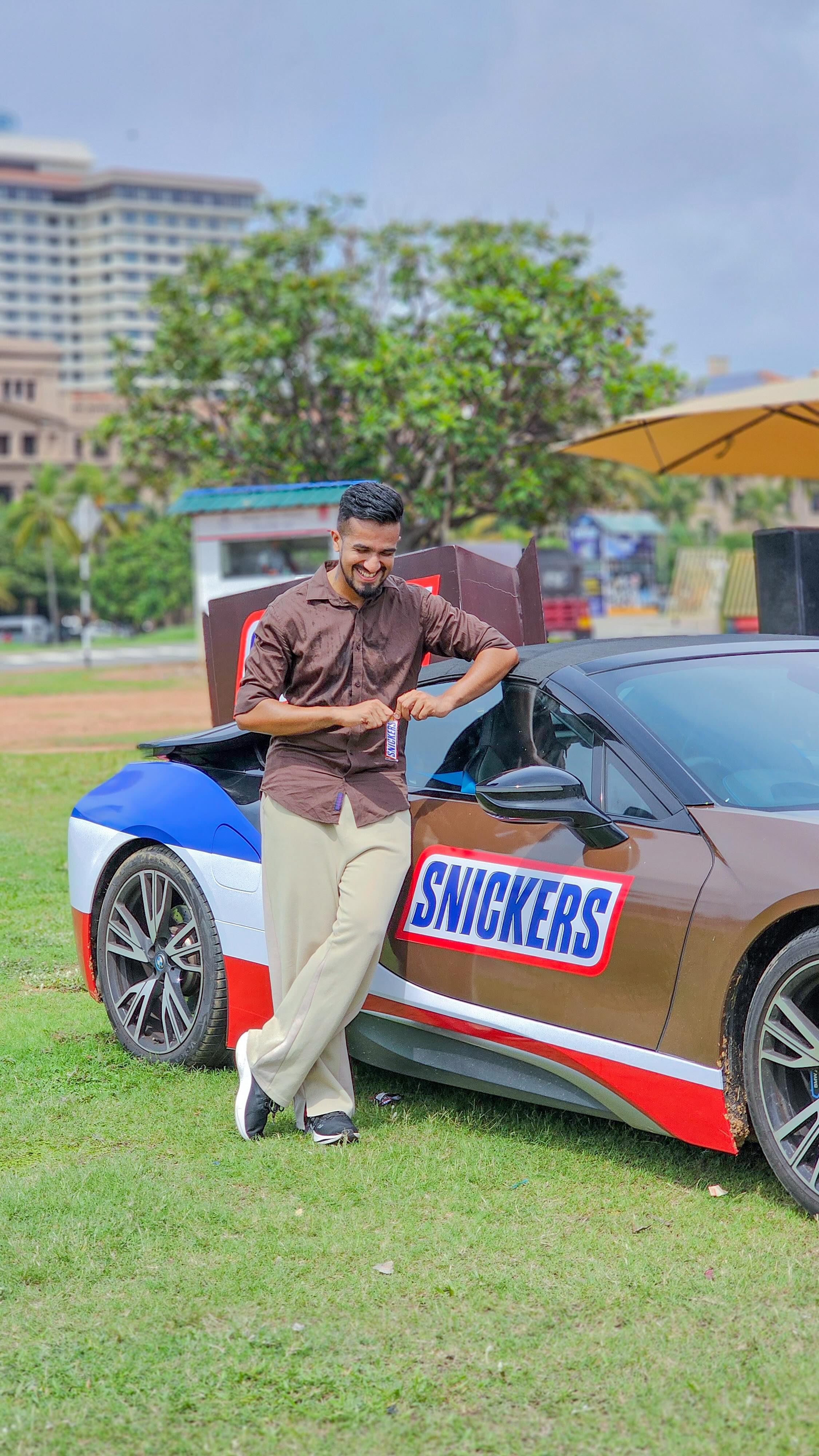Instagram post by @viindula for Snickers. Caption reads: Snickers is officially launching in Sri Lanka!....