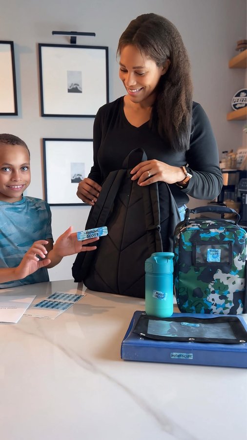 Instagram post by @ashleyimperfect for Name Bubbles. Caption reads: Simplify school mornings with Name Bubbles ✨📚....