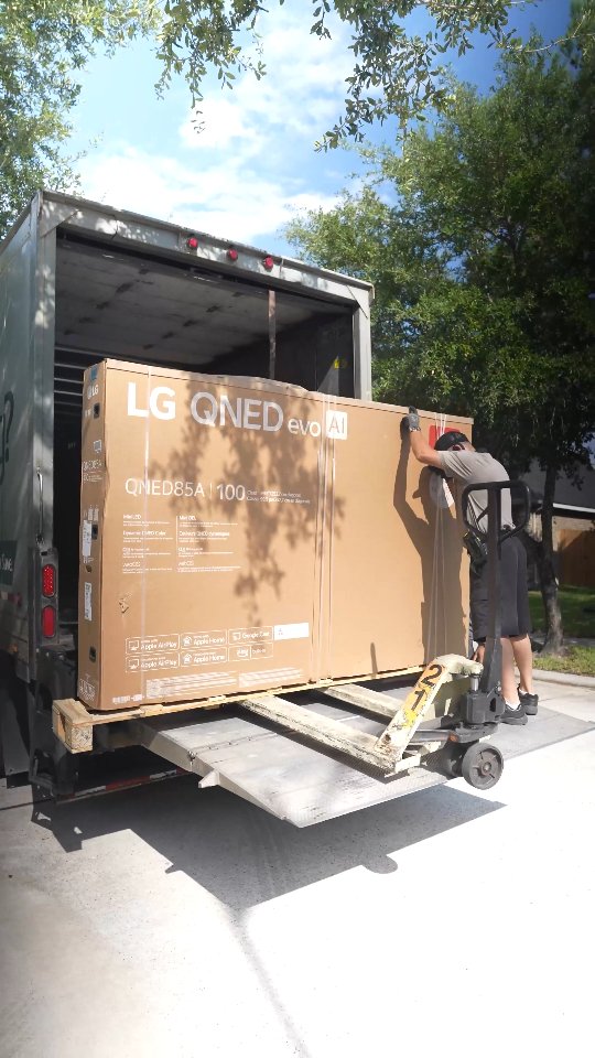 Instagram post by @booredatwork for LG USA. Caption reads: #AD @LGUSA Just unboxed the LG QNED evo AI QNED85A....