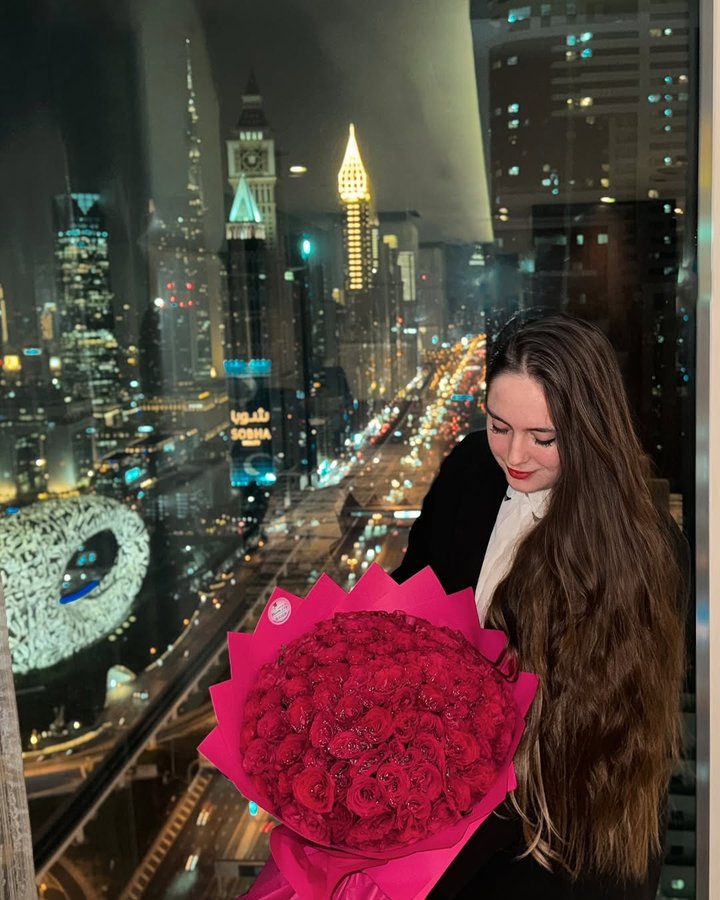 Instagram post by @jelisaofficial for Burj Khalifa by Emaar. Caption reads: In a world black and white , be a rose 🌹.