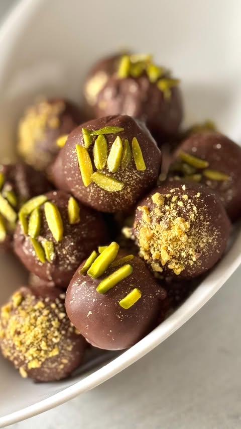 Instagram post by @viktoris_sweet_and_small for Marks and Spencer. Caption reads: Pistachio Date Chocolate Balls - HEALTHY DUBAI....