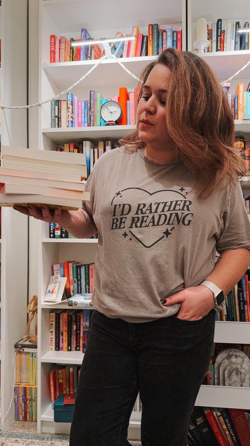 Instagram post by @alltheradreads for TeePublic. Caption reads: build your bookish wardrobe on @teepublic 📚🛍️....