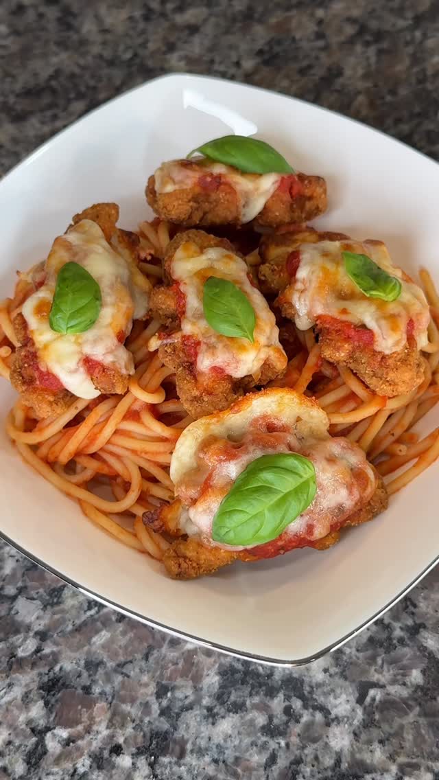 Instagram post by @megdabber_ for Real Good Foods. Caption reads: Viral Dino Chicken Parm Nuggies 🍝🦖✨ Made with....