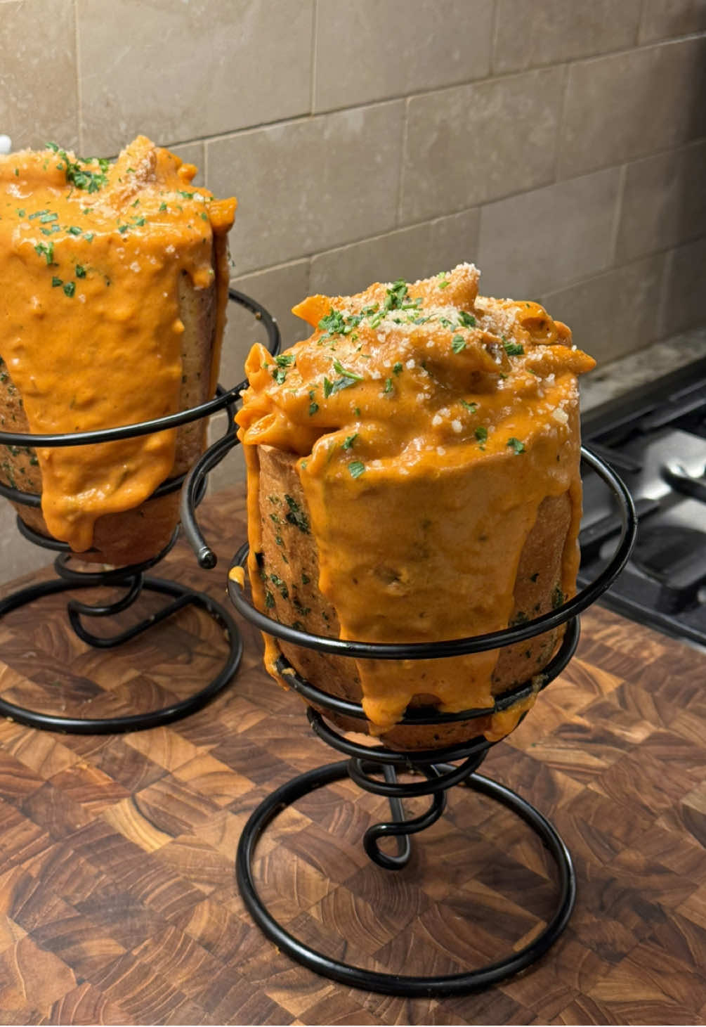 TikTok post by @erin.lim for Hero Bread. Caption reads: cheesy vodka pasta stuffed garlic bread 🧄 after....