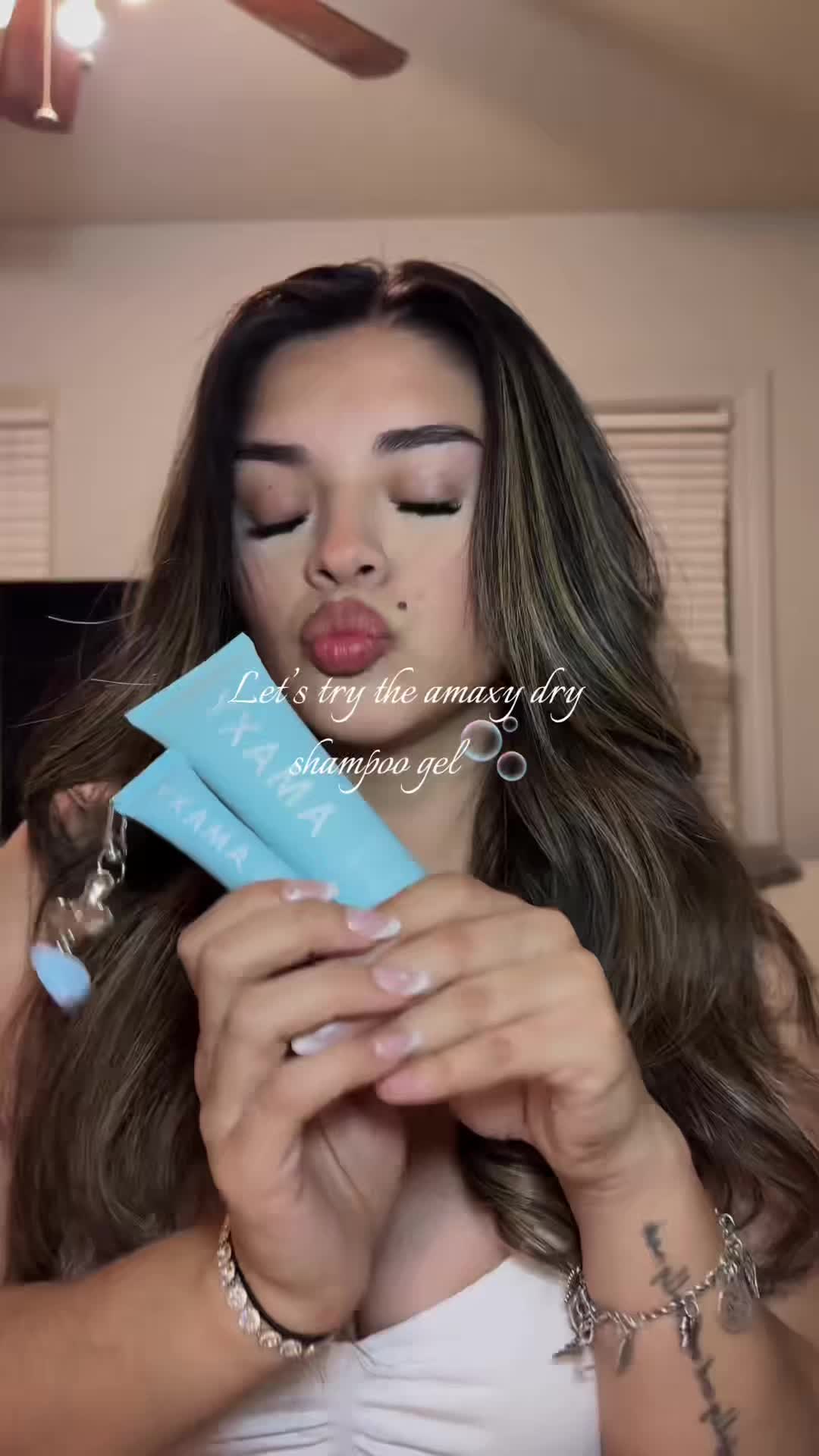 TikTok post by @melissareyezz for AMAXY Beauty. Caption reads: Finally found the perfect dry shampoo♥️🫧 #amaxy....
