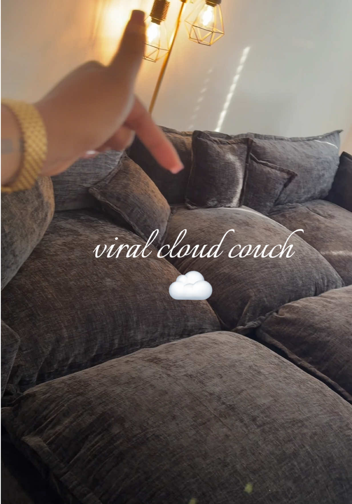 TikTok post by @cradeja for OVIOS OFFICIAL. Caption reads: I finally ordered the viral couch couch that y’all....