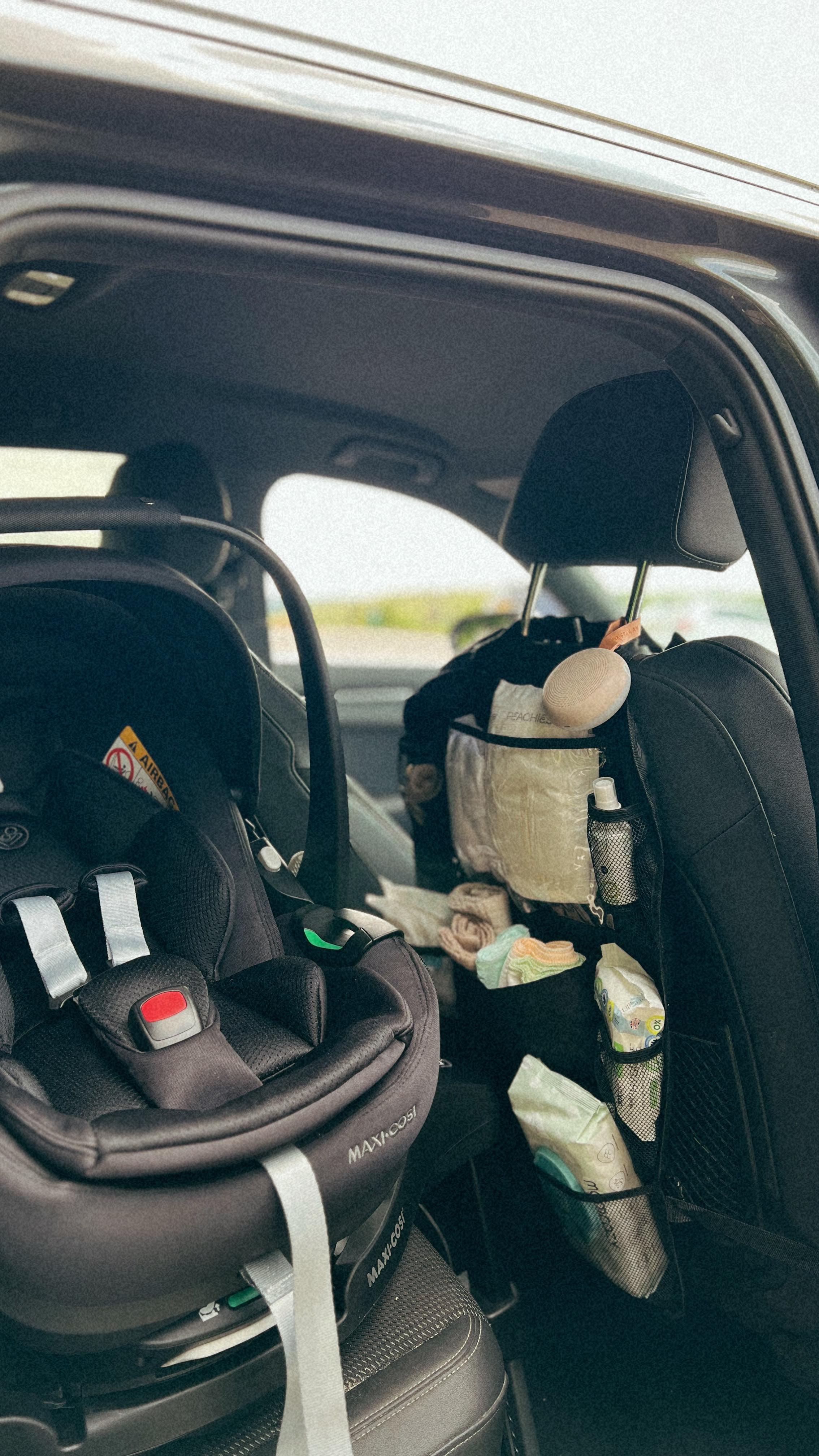 Instagram post by @laura.l.byrne for Maxi-Cosi. Caption reads: Setting up the car ready for baby and I just know....