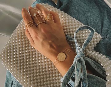 Instagram post by @_evaciland for Satya Jewelry. Caption reads: #ad Meet my newest @satyajewelry obsession of....
