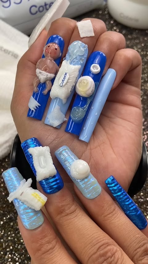 Instagram post by @ilysmnails for Coterie. Caption reads: Baby Diaper Nail Art with @Coterie 👶 Created a....