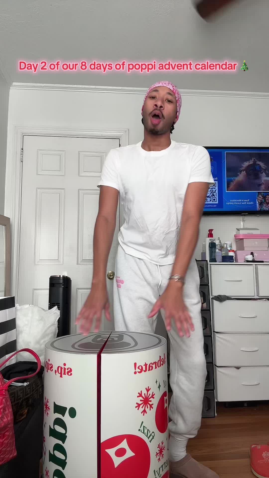 TikTok post by @cameronjerrard for Poppi. Caption reads: Day 2 of our 8 days of @drinkpoppi ❄️🎅🏽 #fyp....