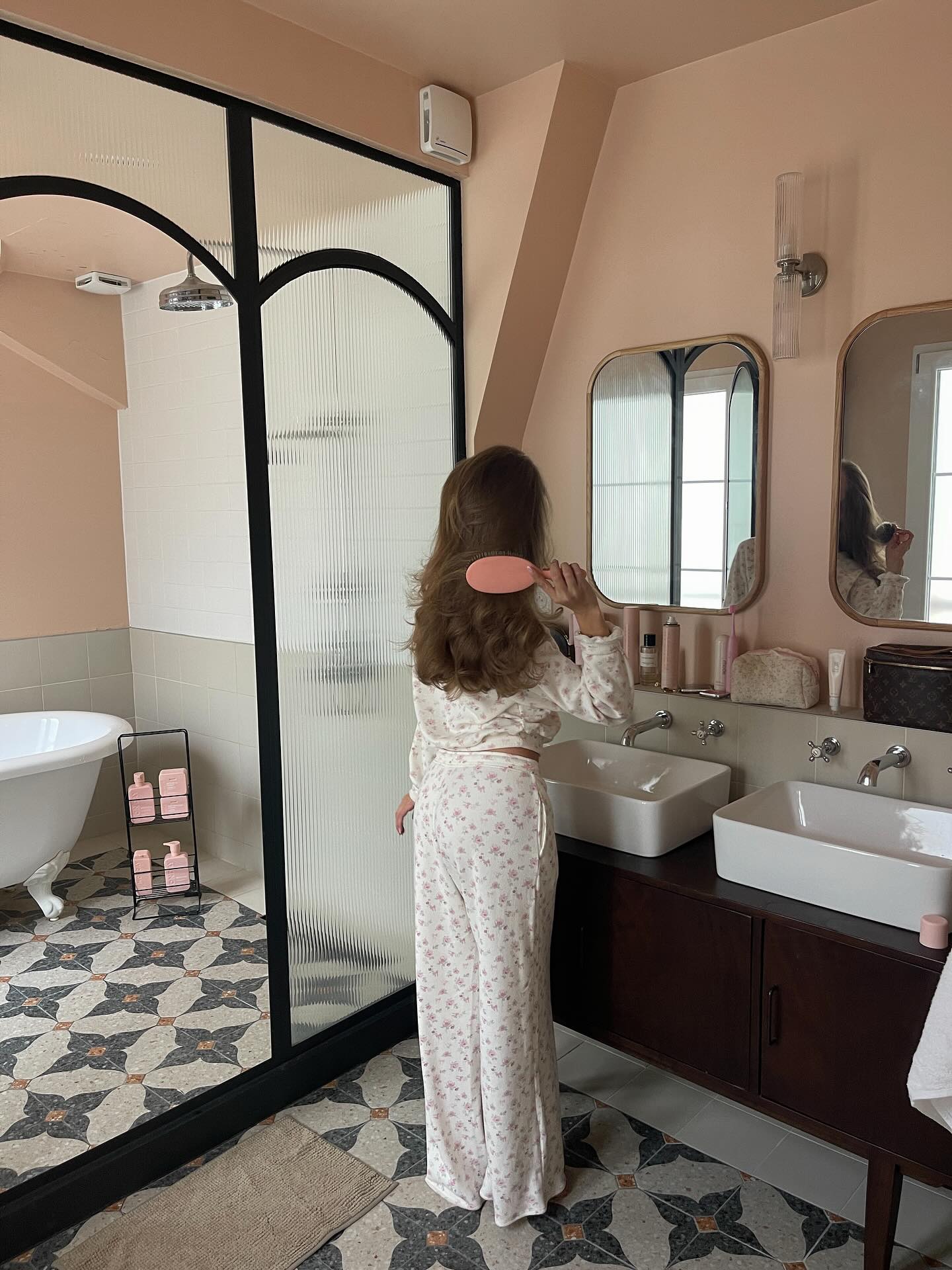 Instagram post by @annaastrup for MONDAY Haircare. Caption reads: advertisement | paris mornings with....