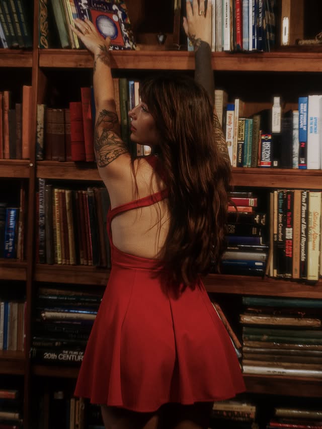 Instagram post by @marielaa.rc for Ethnasia Jewelry. Caption reads: Playing around at the library and it got me....