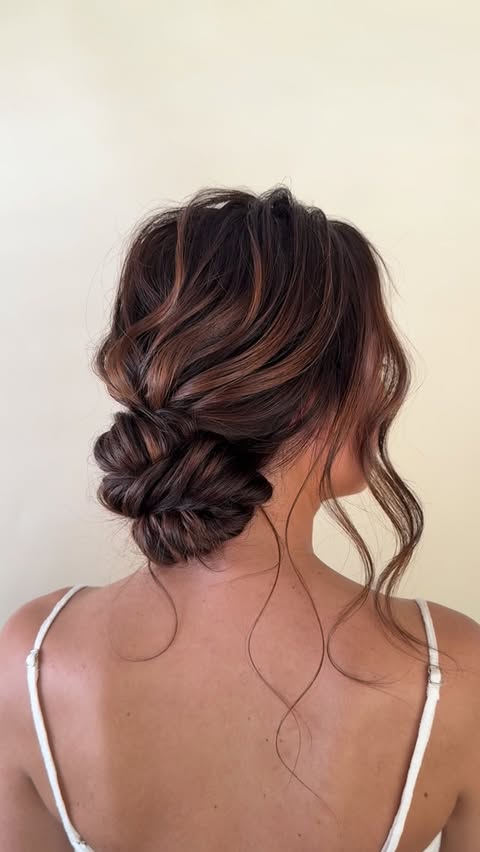 Instagram post by @updos.by.jocelyn for Moroccanoil Professionals. Caption reads: This is the updo hairstyle that I taught yesterday....
