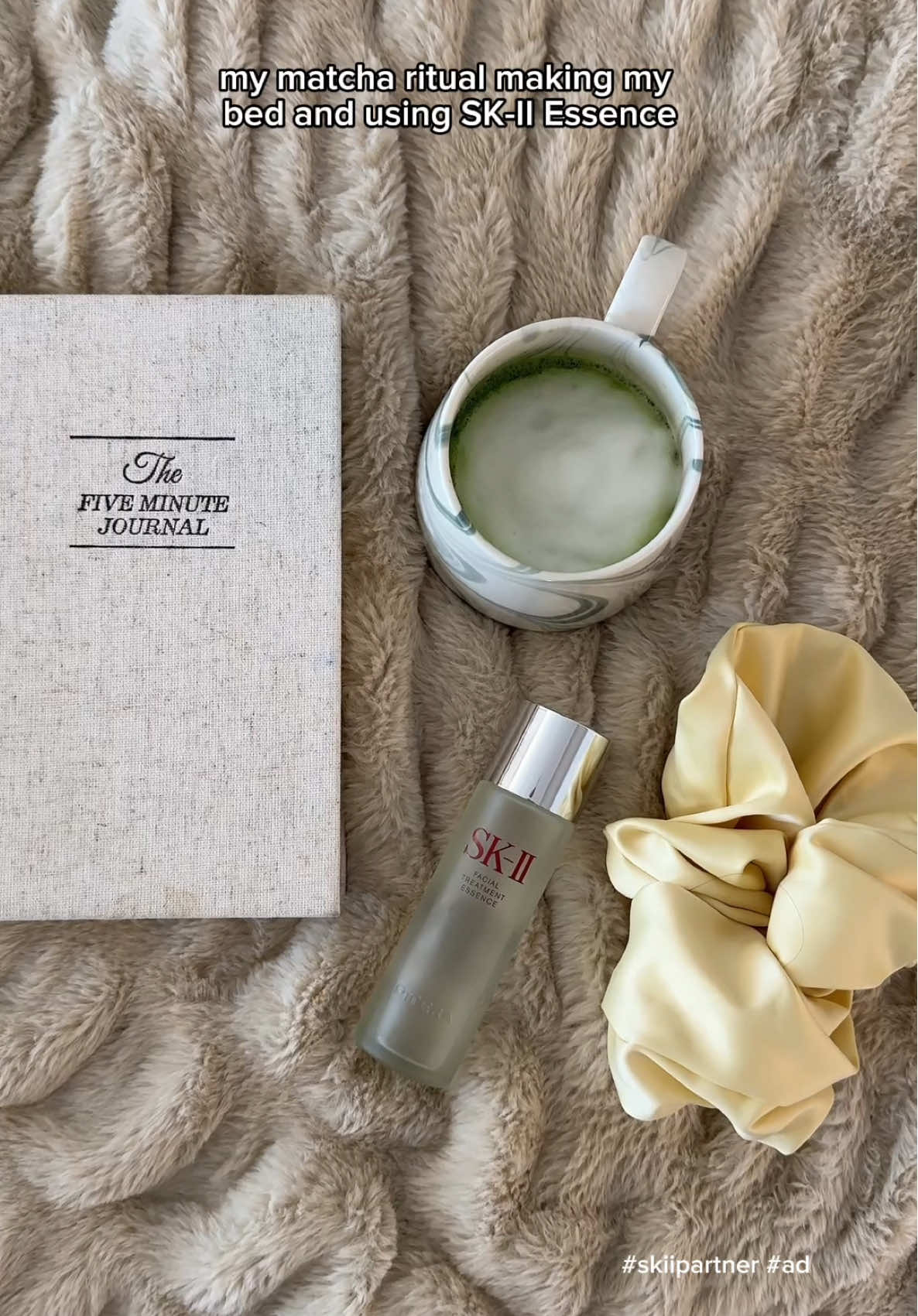 TikTok post by @rutaenroute for SK-II. Caption reads: #ad #skiipartner One of my morning non-negotiables....