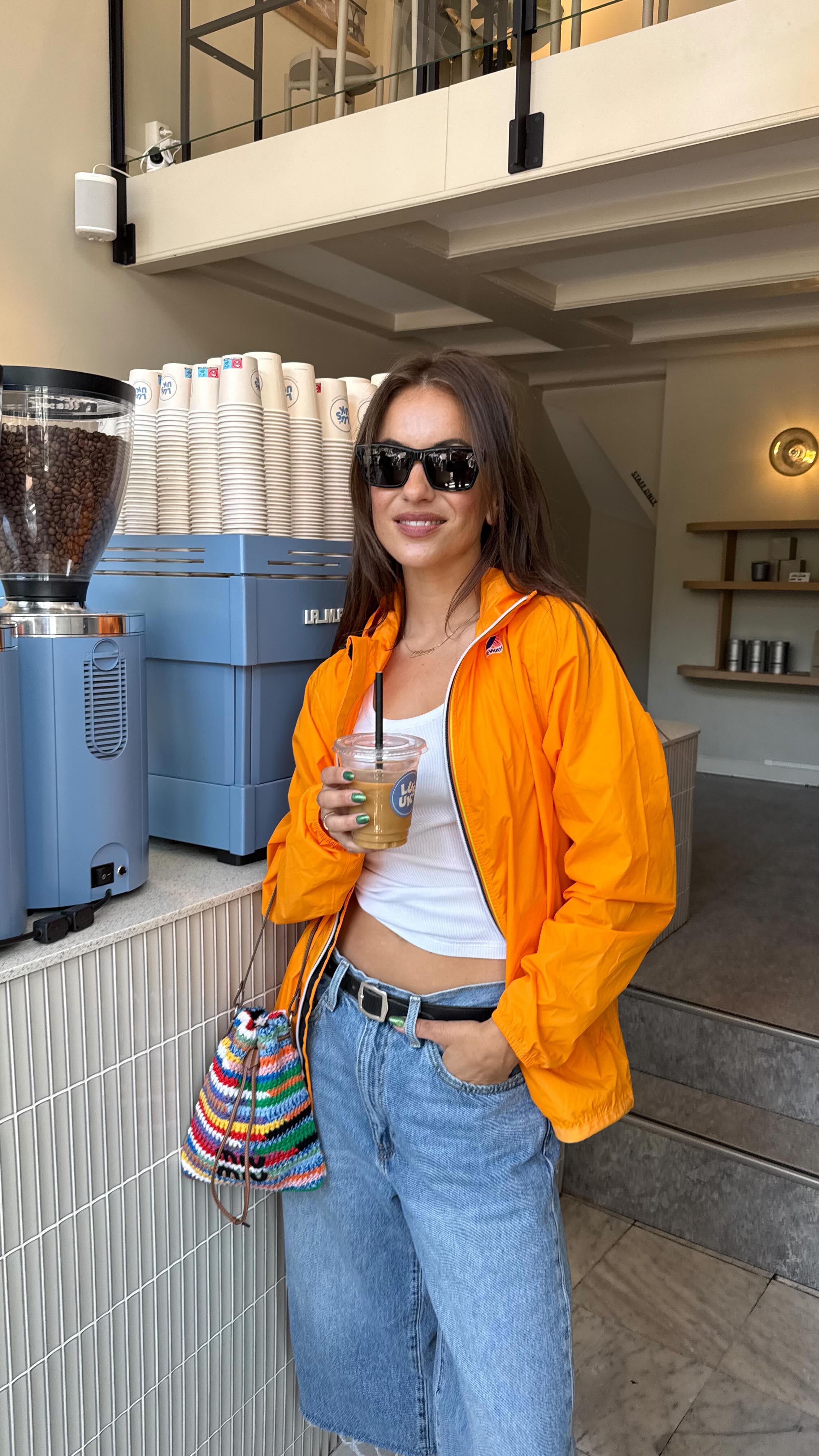 Instagram post by @lizzyvdligt for K-way. Caption reads: Team Pink 🩷 or Orange 🍊 @kway_official....