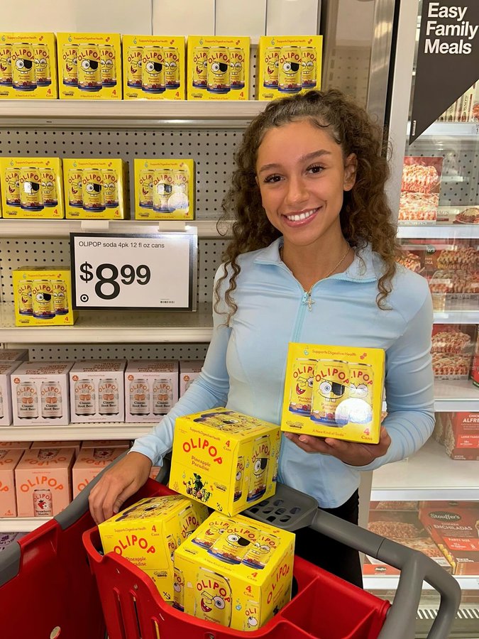 Instagram post by @dacialew for 98Strong. Caption reads: @target has all the OLIPOP goods!

Highly....