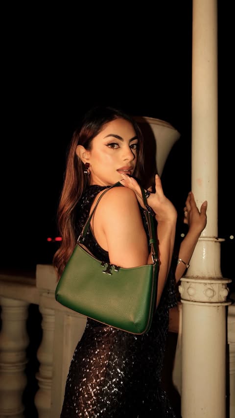 Instagram post by @ravkirat_ for AJIO. Caption reads: [...] Bag ✨

#ToryBurchHoliday25 #ToryBurch....