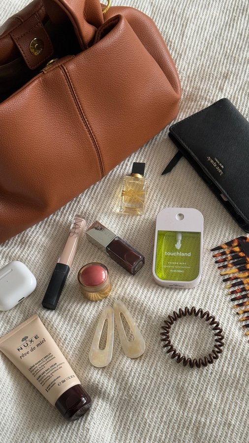 Instagram post by @itsabeauty_thing for Rock & Ruddle. Caption reads: what’s in my handbag 👜 ✨ 
 
 
 
contains pr | no....