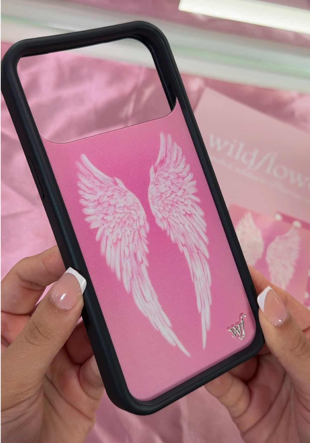 TikTok post by @saraiepalacio for Wildflower Cases. Caption reads: [...] baby wildflower phone case 🪽🩷 @Wildflower....