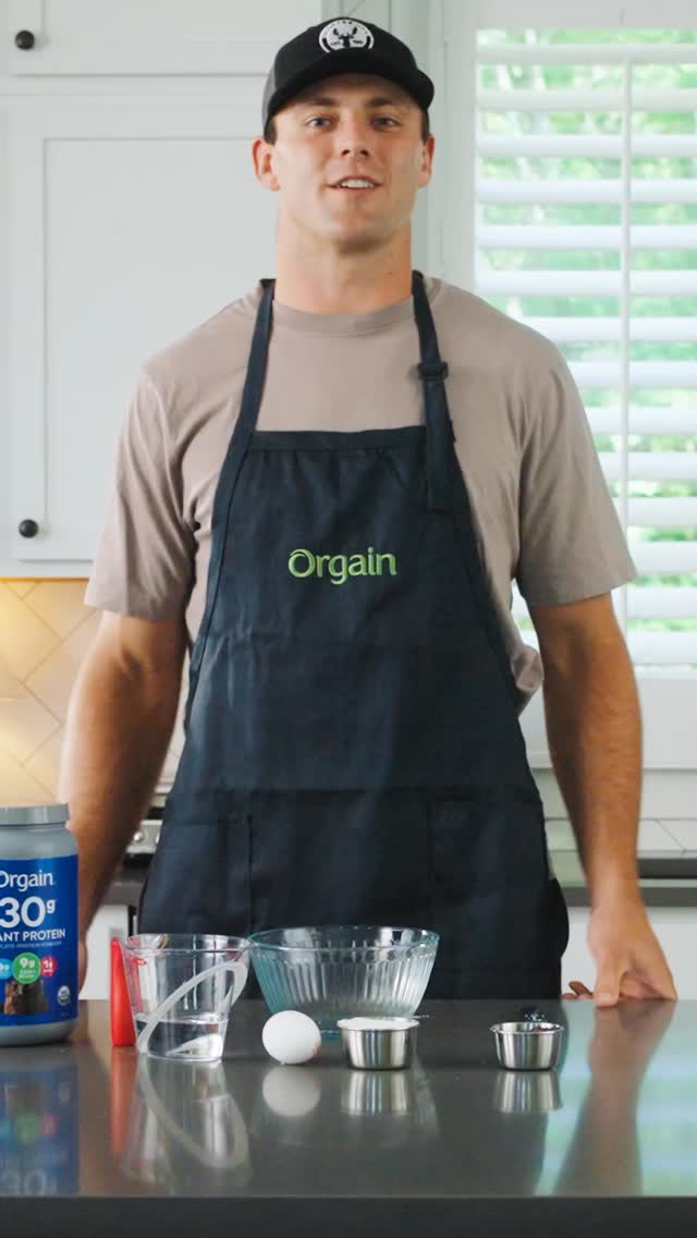 Instagram post by @brockbowers for Orgain. Caption reads: [...] up on my go-to protein during the....