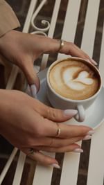 Instagram post by @lacoscione for Herno. Caption reads: sophisticated and timeless 🤎
@herno_official....