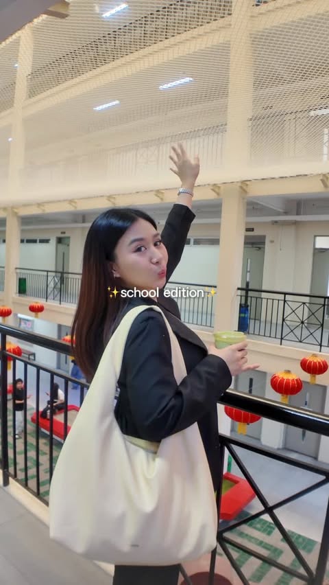 Instagram post by @deniseejuliaa for Shopee Philippines. Caption reads: mini school vlog with my school must-haves ✏️🧡....