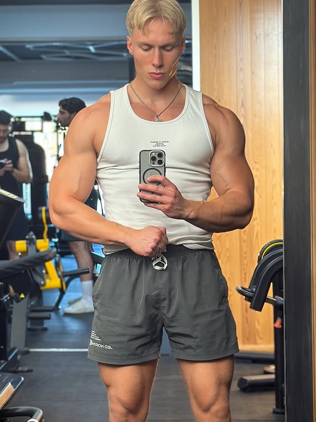 Instagram post by @aaronschoening for Jed North. Caption reads: [...] . . #zyzz #arms #aesthetics #physique....